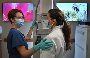 Medical personnel in discussion during a health appointment.